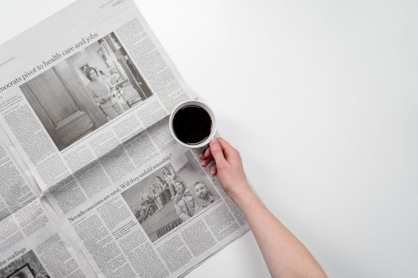 Coffee and newspaper flatlay